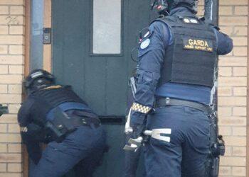 Cash, cryptocurrency, computers and more seized with two men arrested as part of international investigation into organised fraud
