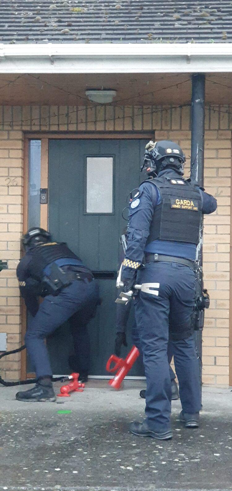 Cash, cryptocurrency, computers and more seized with two men arrested as part of international investigation into organised fraud