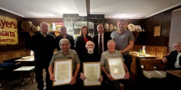 Minister of State John Cummins stops off in county Kilkenny town to celebrate four local men
